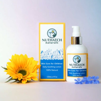 Nuthatch Naturals skin cream box and bottle with a sunflower product shot