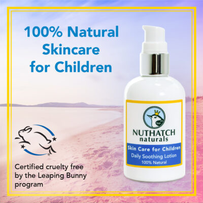 nuthatch naturals image of bottle with a beach as the background. 100% natural and cruelty free skin care for kids